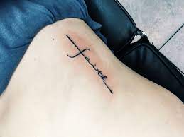 My First Tattoo A Cross On My Ribs With The Word Faith Incorporated Tattoos For Women Neck Tattoo Meaningful Wrist Tattoos