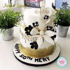 A gradient black and white wedding cake with white anemones, greenery and blush blooms is very elegant. Cake With Flowers
