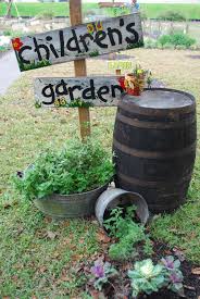 Helping Children To Love The Garden Give Them A Little Garden Space With Easy To Grow Veggies Even Have The Gardening For Kids Garden Signs Preschool Garden