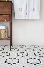 This is especially useful in a bathroom where tiled, waterproofed surfaces are just plain practical. Budget Friendly Diy Bathroom Redo Domino Cheap Tiles Bathroom Redo Bathroom Floor Tiles