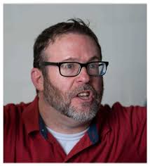 Choir practice. Tucker is the director.