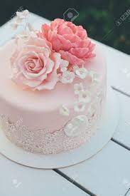 Maybe you would like to learn more about one of these? Pink Glazed Cake With Flowers On Top For Wedding Stands Delicious Stock Photo Picture And Royalty Free Image Image 111763352