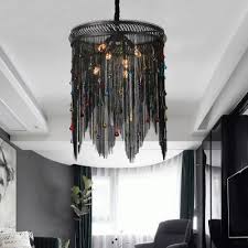 Chandelier lighting also hangs from the ceiling but features a branched system with many lights as opposed to one light like pendants. Black Tassel Chandelier Lighting 6 Lights Rustic Metal Chain Pendant Light For Living Room Beautifulhalo Com