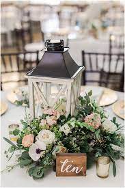 34 Chic Wedding Decoration Ideas With Lanterns On A Budget Lantern Centerpiece Wedding Bridesmaid Flowers Spring Wedding Flowers
