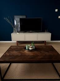 White sofa and glass end table with vases set against pale blue wall. Jysk Dark Wood Coffee Table Coffee Table Wood Dark Wood Coffee Table Coffee Table