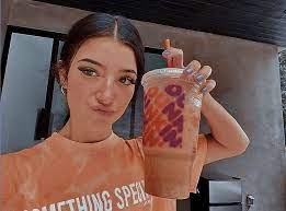 Charli D Amelio Dunkin Dunkin Dounts Dunkin Donuts Cute poses for pictures editing pictures photo editing jersy boys film aesthetic. dunkin dounts dunkin donuts