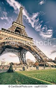 The beacon, sending out two light beams with a reach of 80 kilometres, is composed of 4 marine motorised projectors shining over paris. Bottom Up View Of Eiffel Tower In Paris France Canstock