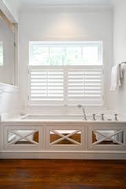 One of the most common uses for blocks is in old houses where door casing and base meet. Mirrored Tub Surround Transitional Bathroom Amanda Orr Architects