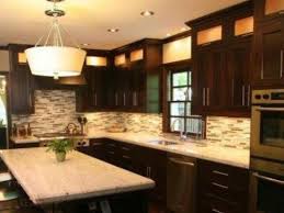 Contrast Brown Kitchen Cabinets With White Granite Countertops Jpg 500 375 Pixels Mission Style Kitchen Cabinets Kitchen Cabinet Styles Brown Kitchen Cabinets