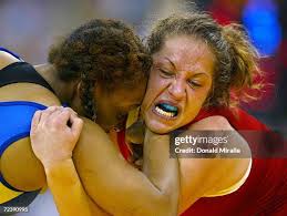 Satrinina Vernon wrestles with Iris Smith during the 2004 Olympic... News  Photo