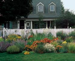 This homeowner has used the space between the sidewalk and his house to create a garden filled with beautiful flowers and a tree that will provide tons of shade in the future. Front Yard Gardens Make A Strong First Impression Finegardening