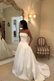 Mermaid silhouettes are particularly suitable for brides with hourglass, inverted triangle, or rectangular body shapes.for a dress that focuses on accentuating your curves, select lighter weight fabrics like silk and satin. Strapless Open Back Satin Wedding Gown With Pockets Sophisticated Wedding Dresses Wedding Dresses Satin Ball Gowns Wedding