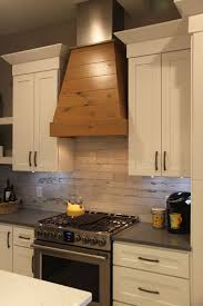 Wood Covered Vent Hood Wood Look Ceramic Tile Backsplash Degraaf Interiors Wood Backsplash Tile Backsplash Ceramic Tile Backsplash