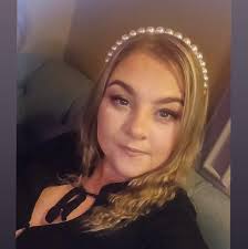 My sister all dressed up taking pictures showing attitude