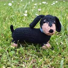 Introducing my small sausage dog knitting pattern, a quick little knit to use up odds and ends of yarn. Ravelry Dachshund Puppy Pattern By Amanda Berry