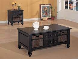 A black metal frame adds style and durability to this coffee table with a lift top. Black Classic Coffee Table With Sea Grass Baskets