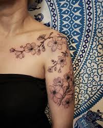 Black And White Cherry Blossom Vine Tattoo 27 Charming Cherry Blossom Tattoo Examples Blossom Tattoo Vine Tattoos Cherry Blossom Tattoo Shoulder