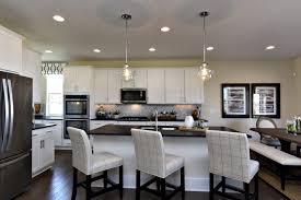 This custom kitchen island makes the kitchen look bigger and doubles the counter space, and it gives friends and family a special place to gather. Video 5 Ways To Make Your Kitchen Feel Bigger New Homes Ideas
