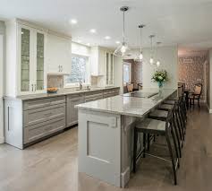 White and green kitchen with vintage range. Hot Home Trend To Watch The Two Toned Kitchen