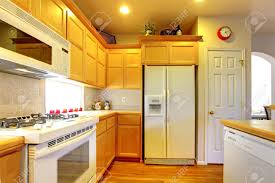 kitchen with yellow wood cabinets and