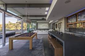 Mid Century Meets Contemporary Glam In The Home Of Beauty Magnate Davis Factor Nonagon Style Modern Pool Table Modern Pool Table Room Mid Century Modern Pool Table