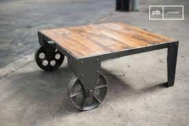 Use potted plants as tabletop décor to match the design concept of this table cart with wheels. Railroad Cart Coffee Table Robust Full Of Character Pib