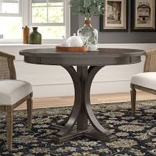 The dining table is 42 x 42 round shape and can fit up to 4 side chairs. Round Dining Table Birch Lane