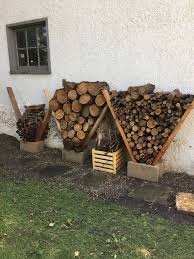 Storing Fire Wood Clean Looking And Organized Keeps Fire Wood Dry And Off Wet Soil Backyard Fire Backyard Diy Backyard