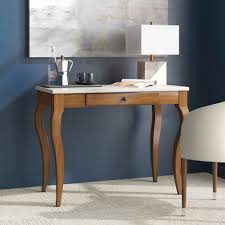 On a walnut rectangular support on four feet. Picket House Furnishings Melony Desk With Marble Top In White Overstock 32500124