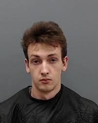 Two men arrested for business break-in, stolen weapons possession