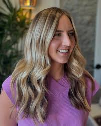 Maintaining a vibrant blonde after highlights can be a challenge. Thats why  we love to finish our color with a gloss! After your highlighting session,  a gloss not only enhances shine but