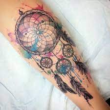 The typical dream catcher design has a handmade web or net with loop decorated with feathers, beads and other objects. 1001 Ideas For A Cute And Elegant Dream Catcher Tattoo