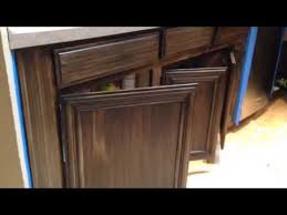 Glaze kitchen cupboards that are painted with a stain several shades darker than the paint color or with a deep brown for a true antique look. Antique Gel Stain Glaze On Light Cabinets Youtube