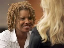 Continental flight attendant Sharon Brown, left, visits with a friend in the courtroom during a break Thursday, Aug. 7, 2008 in Houston. - 8829799_BG1