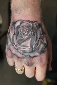 Black And Grey Rose Hand Tattoo Tattoo By Mirek Vel Stotker Rose Tattoos For Men Rose Tattoos Tattoos For Guys