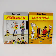 LUCKY LUKE) 1st editions of 2 volumes of the comic strip LUCKY LUKE,  MORRIS, Bob de GROOT