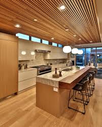 Recessed lights, usually the main ceiling area are using this recessed light and it's also can be dimmed. Luxury Modern Kitchen Featuring Wood Ceiling And Marble Counters In Luxury Home Kitchen Ceiling Design Wood Ceilings Luxury Kitchens