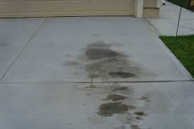 Using baking soda to clean up the grease. How To Remove Oil Stains From Concrete The Driveway Doctor