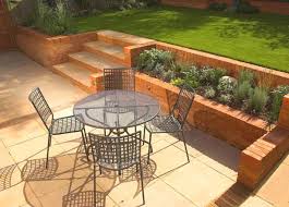 16 Outstanding Ideas To Decorate Your Yard This Spring Season Landscaping Retaining Walls Sloped Backyard Backyard Garden Design
