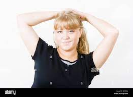 cute chubby blonde posing on a white background Stock Photo - Alamy