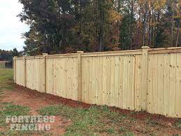 Wooden privacy fence hides wall. Residential Wood Fencing Fortress Fencing Wood Fence Fence Design Privacy Fence Designs