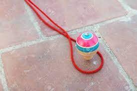 Lots of activity play toys to choose from. Classic Wooden Spinning Top Toy With String Stock Photo Picture And Royalty Free Image Image 140113428
