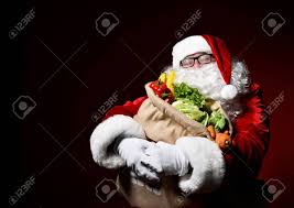 Did you wait too long to plan a christmas/holiday dinner? Jolly Santa Claus Is Holding A Big Bag Full Of Fruits And Vegetables Stock Photo Picture And Royalty Free Image Image 134111387