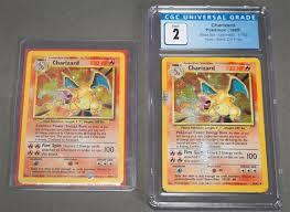 Why it's worth so much: Lot Two Charizard Holographic Pokemon Cards Each Damaged One With Black Dot Error