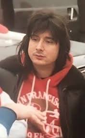 Who is the person in the picture at Steelers game?