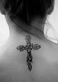 The immense popularity of cross tattoos also makes them a big style statement among men and women alike. Black And White Floral Cross Tattoo On Girl S Nape