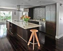 While dark hardwood floors can suit almost any décor style, they are most often used with traditional and rustic schemes. How To Use Dark Floors To Brighten Your Dull Home Dark Kitchen Floors Dark Kitchen Kitchen Flooring
