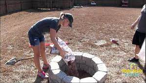 This space allows you to select the size of your pan, which holds up your burner and fire glass (or rocks) and fulfills the essential job of leaving space at the bottom of the fire. Build A Diy Stone Fire Pit In 2 Hours Mama Needs A Project
