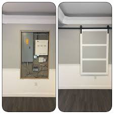 Sourcing guide for fuse box cover: Modern Barn Door To Cover Fuse Box Basement Living Rooms Utility Room Organization Laundry Room Makeover