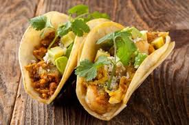 Tacos come topped with cabbage. Media Bluewater Grill Seafood Restaurant